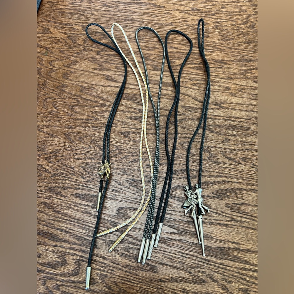 Five braided leather* bolo ties, two with square dancers